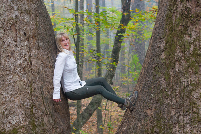 women between two trees